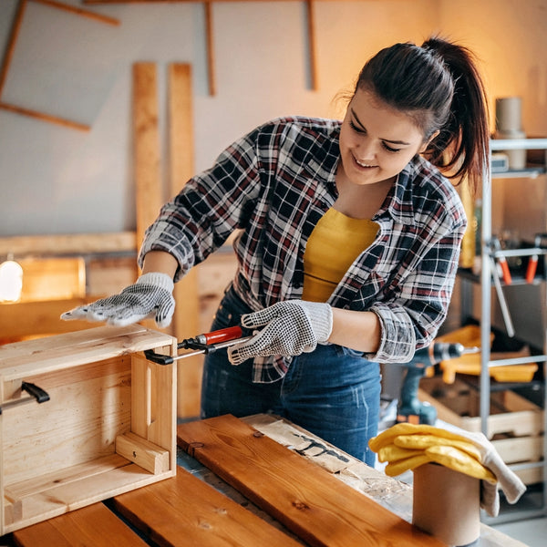 Woman working with wood in a workshop